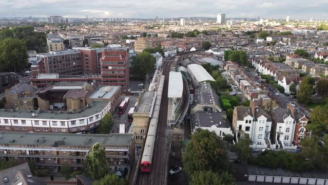 Drone footage of a train arriving at Putney Bridge.