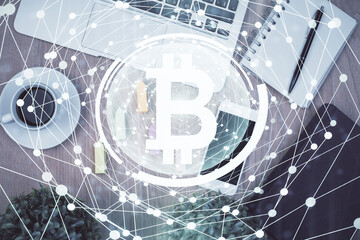 Double exposure of blockchain theme hologram over table with phone. Top view. Crypto technology concept.