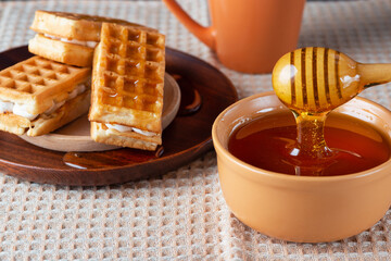 Breakfast with Belgian waffles, honey and coffee
