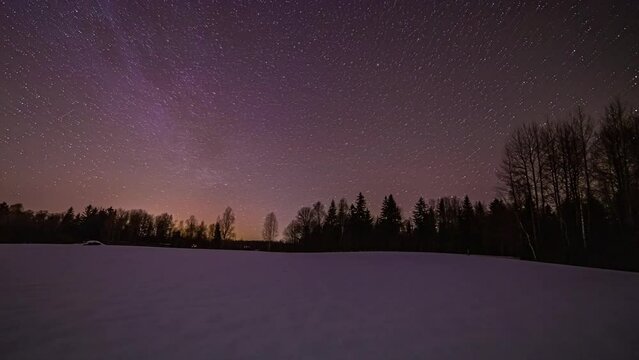 Magical night lapse of stars as they orbit in the vibrant polar night sky