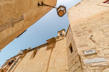 Old fortress buildings with a clear sky above in old Malta Capital Mdina