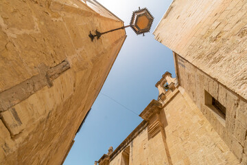 Old fortress buildings with a clear sky above in old Malta Capital Mdina