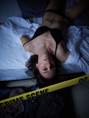 Crime Scene - Woman dead lying on the bed