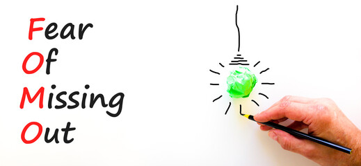 FOMO fear of missing out symbol. Concept words FOMO fear of missing out on beautiful white...