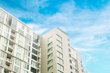 Condominium real estate unit residence. Luxury apartment condo modern stylish. Property for living or investment  with white clouds and blue sky