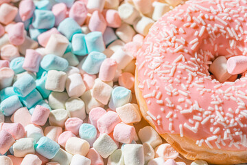 appetizing donuts with marshmallow background