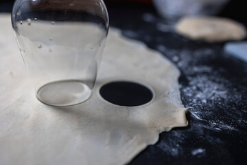 Preparation of a round shape from the dough, a blank for dumplings.