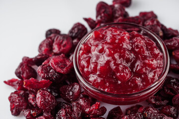 dried cranberry on a white acrylic background
