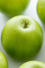 close up of whole green and fresh apples.