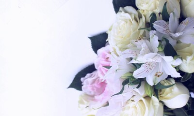 Delicate bouquet in pastel colors on a white background. Festive flower arrangement. Background for a greeting card.