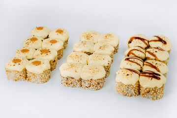 baked sushi rolls on a white background. restaurant menu.