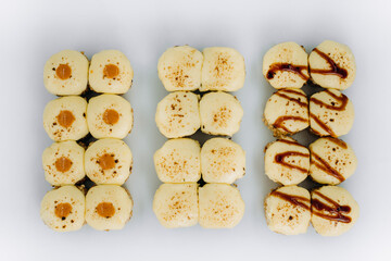 baked sushi rolls on a white background. restaurant menu.