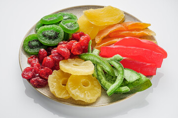 set of various dried fruits on a white acrylic background
