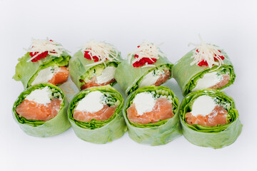 sushi rolls in lettuce with tuna salmon and cheese on a white background. restaurant menu.