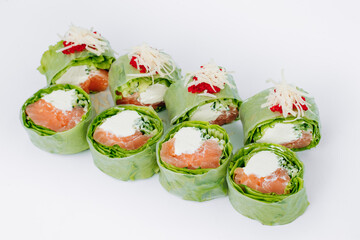 sushi rolls in lettuce with tuna salmon and cheese on a white background. restaurant menu.
