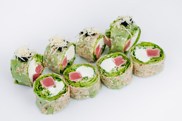 sushi rolls in lettuce with tuna salmon and cheese on a white background. restaurant menu.