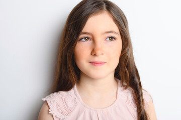 Fototapeta premium pensive cute child over white background on studio
