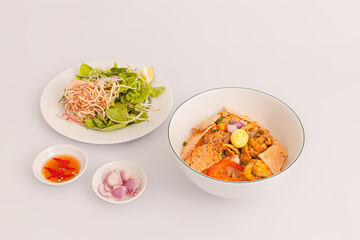 Mi Quang, Vietnamese rice noodles with meat, chicken stock, shrimp, egg, Vietnamese food isolated on white background, perspective view