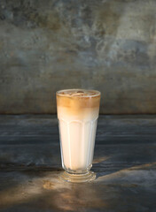 Dalgona cofffee on vintage metallic background