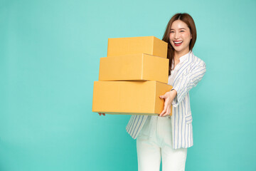 Asian businesswoman holding package parcel box isolated on green background, Delivery courier and...