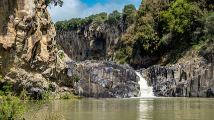 Small waterfall of the Flora river ne small Pellicone lake, Lazio, Italy