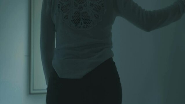 young depressed woman on psychiatric drugs walks staggering