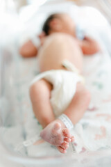 Newborn feet hospital bassinet
