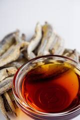 fragrant fish sauce on a white acrylic background