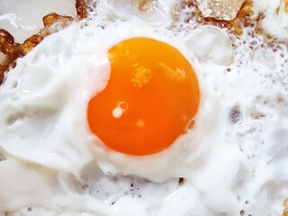 fried eggs close-up for food background, top view