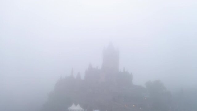 Aerial: Gothic Revival Style On Hill Top, Drone Flying Backwards During Foggy Weather - Cochem, Germany