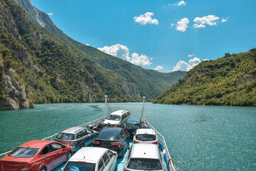 Naklejka premium Beautiful landscape with mountains and green forests on a boat trip on the Komani lake in the dinaric alps of Albania