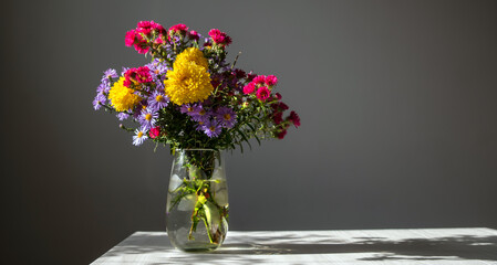 Bouquet of multi-colored chrysanthemums in the sun.