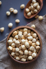 in a wooden bowl with peeled and roasted hazelnuts