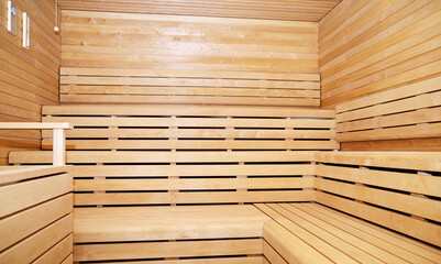 Finnish dry air infrared salt room  sauna with mosaic tiles, wood and crystals inside male locker...