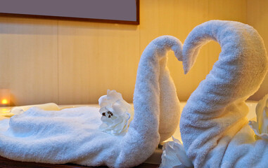 Towel animals folded to swans inside spa wellness thermal lounge treatment room onboard luxury...