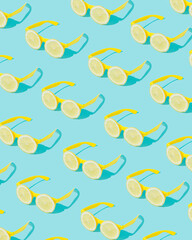 Creative summer pattern made of sunglasses and lemon on a blue background. Minimal concept.