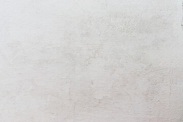Plaster on a gray wall covered with chalk. The texture of the whitewashed plaster is close-up.