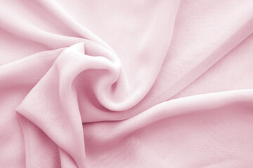 Wavy pink chiffon texture or background, twisted soft transparent chiffon