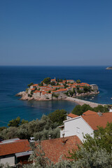 Sveti Stefan Island on a summer sunny day. Hot summer morning. Rest by the sea. The best holiday. Budva, Montenegro.