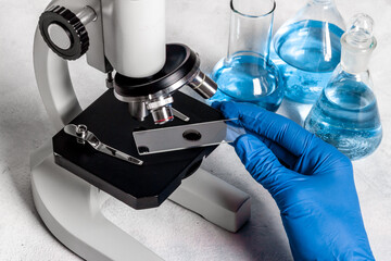 Research in medical laboratory with microscope equipment, close up