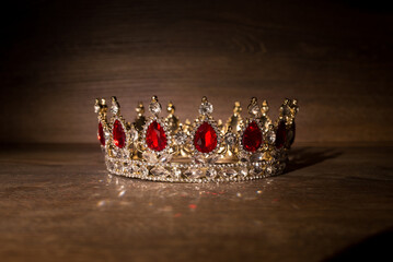 Royal golden crown with red stones. King, queen. - obrazy, fototapety, plakaty