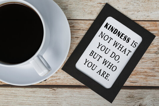 Motivational and inspirational quotes on chalkboard n wooden desk