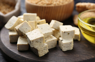 Natural tofu on wooden board, closeup. Soy product