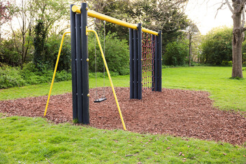 Fototapeta premium Beautiful green park with playground. Outdoor recreation