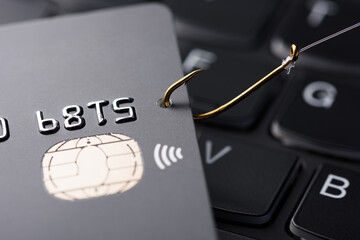 Credit card phishing scam concept. Credit card data theft, card hooked by hacker cyber criminal on...