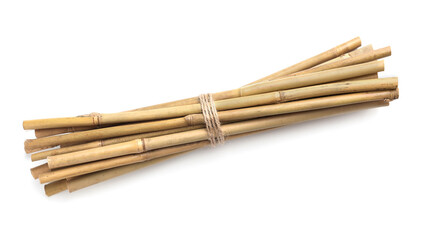 Bunch of dry bamboo sticks on white background, top view