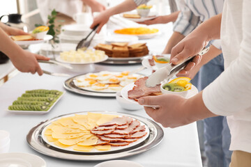 People taking food during breakfast, closeup. Buffet service
