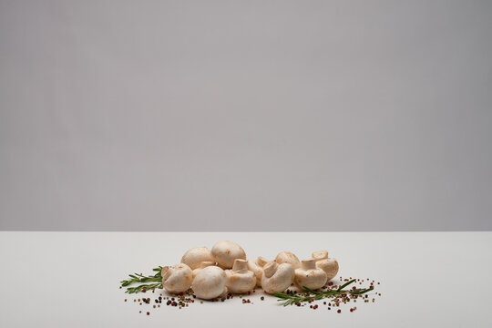 White button mushrooms and pepper minimal background