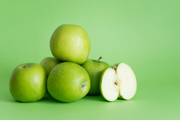 pile of delicious apples on green.