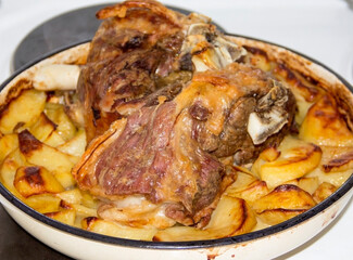 Freshly roasted lamb with potatoes in a pan